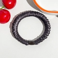 Detail of silk-like black scrunchie with pleated texture and decorative glossy bead - Silk Pleated Hair Band - Dark Brown