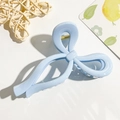 Light blue bow-shaped hair claw clip with glossy finish on a clean white background - Sky Blue Bow Style
