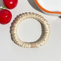 Detailed macro view of champagne silk scrunchie with smooth pleated texture and durable buckle - Skinny Style (Ice Silk Pleated) / Silk Pleated Hair Band - Beige