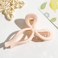 Detail of a pink bow hair claw clip with glossy finish and strong gold metal spring - Light Pink Bowknot Style