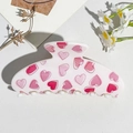 Detailed top view of a white hair claw clip with pink heart patterns and daisy props - UV Printed Square Head-Cream White 169-2