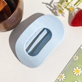 Close-up of minimalist light blue oval hair claw clip with cutout design on natural background - Circular Clip / Sky Blue