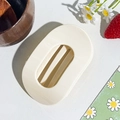 Detail of cream oval hair claw clip with cutout design on a natural aesthetic background - Oval Clip / Nude