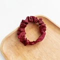 Elegant wine red satin silk scrunchie on a wooden tray with a smooth finish - Burgundy