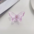 Detailed view of a translucent purple butterfly hair claw clip with golden metal spring - Purple
