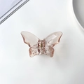 Detail der lichtdurchlässigen Schmetterling-Haarklammer in Meerjungfrau-Pink - Braun