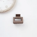 Close-up of matte dark khaki square hair claw clip with strong spring on white lace - Plastic/Resin / Small Square-Coffee