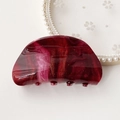 Detail of burgundy marble acetate hair claw clip with glossy shimmering texture - Wine Red Starry Marble