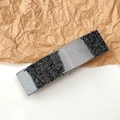Macro detail of French style rectangular acetate hair clip with silver glitter stripes - Glitter Black