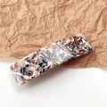 Detail of elegant acetate hair clip with marble pattern on a textured paper background - Marble Beige Coffee