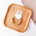 Detail view of yellow high-elasticity hair ties set displayed on a fashion jewelry card - Yellow
