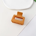 Detail view of the matte caramel square hair claw clip with its durable non-slip teeth design - Matte Ginger
