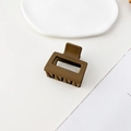Macro shot of matte brown square hair claw clip with geometric hollow design - Matte Coffee
