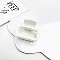 Detailed close-up of a white matte hollow rectangular hair claw clip for elegant styling - Matte Cream White