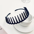 Close-up of matte black non-slip hairband with teeth on a white minimalist background - Navy Blue