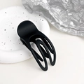 Detail of matte black hollowed hair claw clip on white decorative plate for women - Matte Black