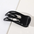 Dettaglio della molletta per capelli nera lucida con design vuoto per capelli folti - Nero Lucido