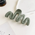 Close-up of wavy matte dark green shark clip on a minimalist decorative white tray - 11cm Wave / Matte Forest Green