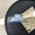 Detail of a large pearlescent blue acrylic hair claw clip on a black textured tray - 8cm Square Head Claw Clip / Fantasy Blue