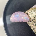 Detailed top view of a pearlescent shell-shaped hair claw clip on a minimalist black tray - 8cm Round Head Claw Clip / Phantom Purple