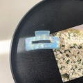 Close-up of geometric rectangle hair claw clip with iridescent blue pearlescent texture - 7.5cm Rectangle Claw Clip / Fantasy Blue