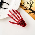 Détail de la pince à cheveux main de squelette rouge brillant pour décoration de Halloween - Rouge
