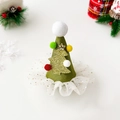 Detail of green satin Christmas hat hair clip with lace trim and gold glitter tree - Pompom Christmas Tree