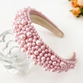Detailed side view of a thick pink sponge headband with multi-sized faux pearls - Pink