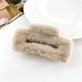Close-up of beige plush faux fur hair claw clip with a rectangular hollow design - Khaki