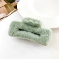 Close-up of the plush faux fur texture and square design of the light green hair claw clip - Fruit Green