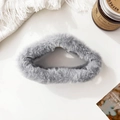 Close-up of grey plush cloud hair claw clip with soft faux fur texture and metal spring - Gray