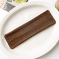 Detailed view of dark brown elastic knitted yoga headband on a minimalist white tray - Brown