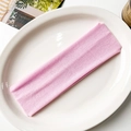 Detailed macro view of the elastic ribbed knit texture on the pink yoga headband - Pink