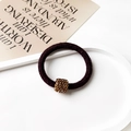 Detail view of dark brown elastic plush hair tie with square gold glitter accent - Square Decor Style / Dark Coffee