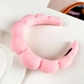 Close-up of pink flannel cloud headband showing soft plush texture and wavy design - Water Pink