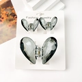 Détail de trois pinces à cheveux papillon translucides sur une carte de présentation - Ensemble Cœur Vert Gris Transparent