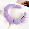 Detail of light purple sponge headband with a soft cloud-like plush texture and wave design - Purple