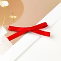 Close-up of a red satin ribbon bow hair clip with smooth texture on a white backdrop - Single Style / Red