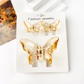 Three-piece butterfly hair claw set in amber translucent resin on display card - Transparent Orange Yellow Butterfly Set