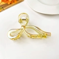Close-up of translucent yellow bow claw clip with iridescent finish and metal spring - 13cm Iridescent Bow (Yellow)