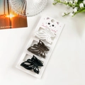Lot de trois pinces à cheveux papillon mates en blanc, marron et noir sur support - Style Papillon Blanc Café Et Noir