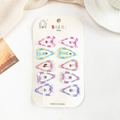 Détail lot de 10 barrettes cheveux cœur à carreaux sur carte de présentation enfant - Cœur
