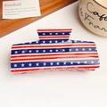 Detail showing high-quality American flag acrylic hair claw clip on wooden tray - Stripe Star Flag Solid Square Clip (10.5)
