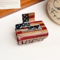 Detailed close-up of American flag acrylic hair claw clip on a rustic wooden tray - Vintage Flag Square Clip (5)
