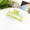 Detail shot of a transparent acrylic hair claw with green pear prints and metal spring - Fruit Green Pear (8.5cm Square)
