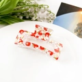 Detailed view of a transparent rectangular hair claw clip with sweet red apple prints - Fruit Apple (8.5cm Square)