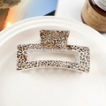 Detail of leopard print hollow rectangular hair claw clip displayed on ceramic tray - Fine Leopard Black Coffee (8.5cm Square)