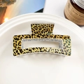 Close-up of leopard print square hair claw clip placed on a white decorative tray - Yellow Leopard White Base (8.5cm Square)