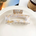 Macro view of square hollow hair claw clip with cream marble leopard pattern - Quicksand Style Pink Coffee (8.5cm Square)