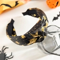 Dettaglio fascia annodata con stelle dorate e tema spaventoso di Halloween per feste - Stile Annodato / Stella Oro